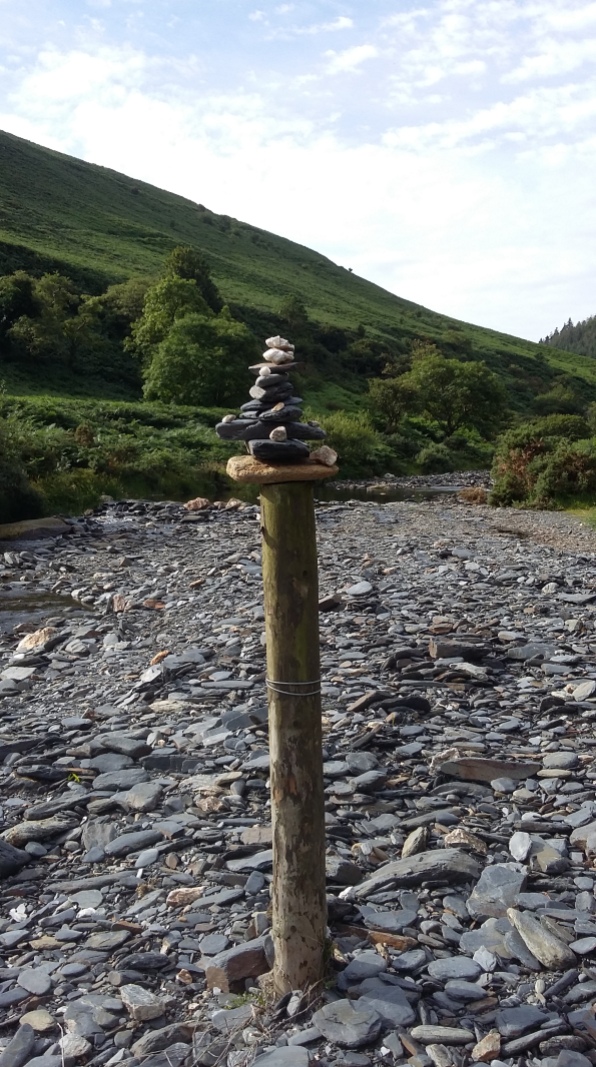 Atop an old post in the riverbed,next to a not on the map stone circle and monolith (new?), near Sulby Glen at the side of the A14 Isle of Man